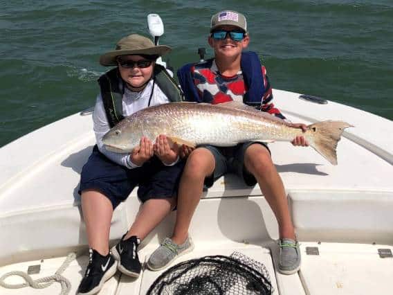 Young Anglers Reel in Giant Redfish